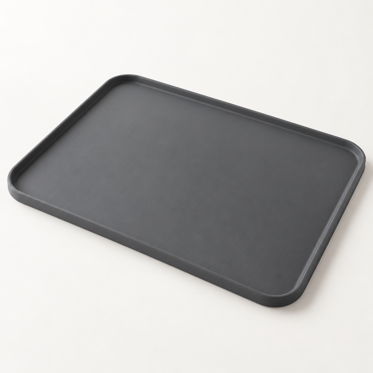 Charcoal-gray Anti-Splash Mat with rounded corners and a raised edge on an off-white studio background.