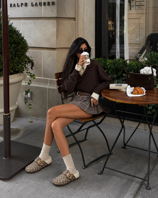 Light Khaki Ivory Ashton clogs styled with white socks and a plaid skirt