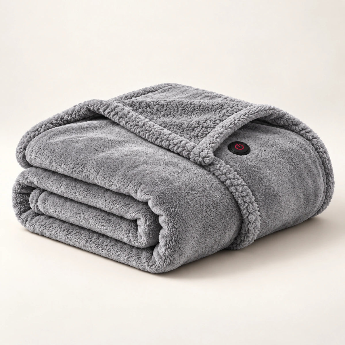 Gray heated wearable blanket folded on an ivory studio background