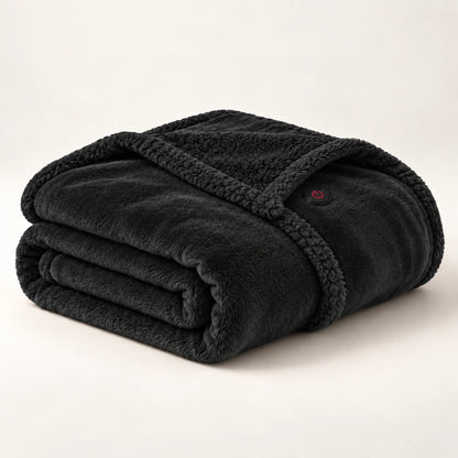 Black heated wearable blanket folded on an ivory studio background